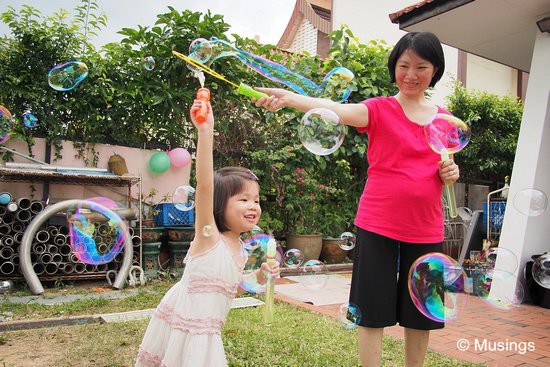 At a cellgroup friend's one year old boy's birthday bash. The two girls had a lot of fun with bubble sticks. You stick them into the bubble solution, and create magnificent waves of bubbles by waving them in the air.