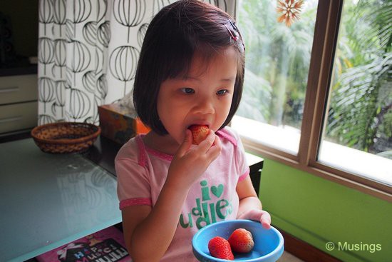 Munching on strawberries.