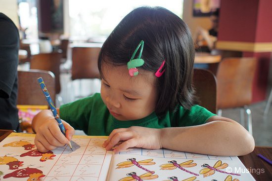 Her activity books are a wonderful means of occupying herself while the both of us have brunch.