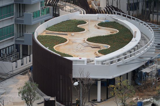 Planter areas on the top of the Retail Outlet block.