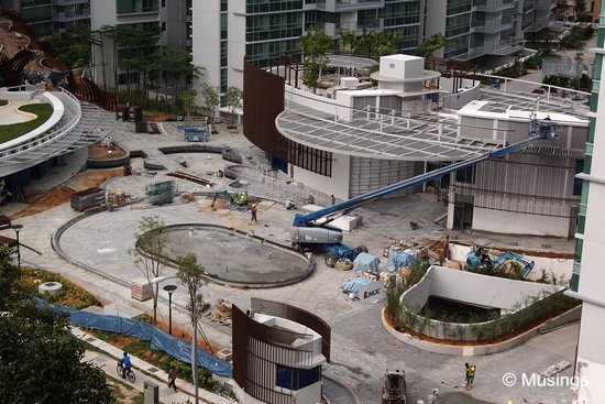 Paving work at the entrance roundabout looks mostly done.