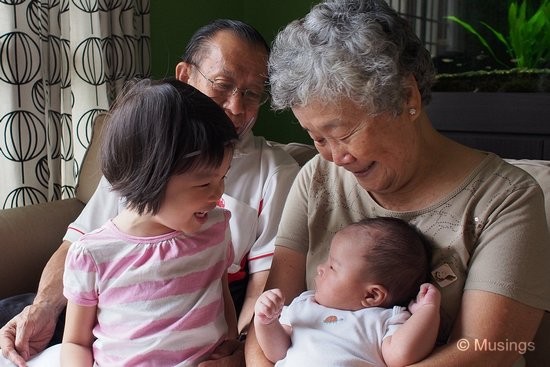 Grandparents' Sunday afternoon visitation. Peter is nonplus with Hannah's attempts at getting him to giggle.