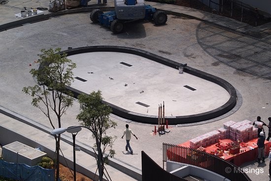 The main gate's roundabout has been built and just lacking its water feature now.