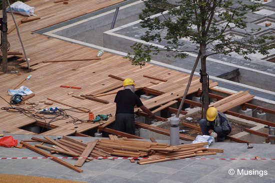 Workers installing decks at the main pool.