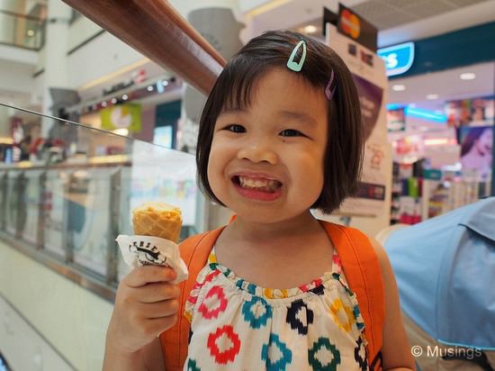 Hannah can't wait for the picture to be taken so that she can continue attacking her Passion Fruit flavored ice-cream from Andersen's.