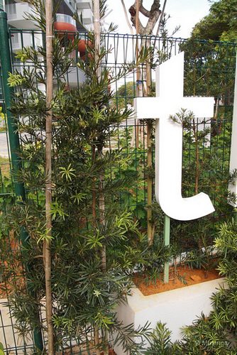 Taking a close look at the shrubbery frame at the corner signage in front of Lorong Ah Soo. 