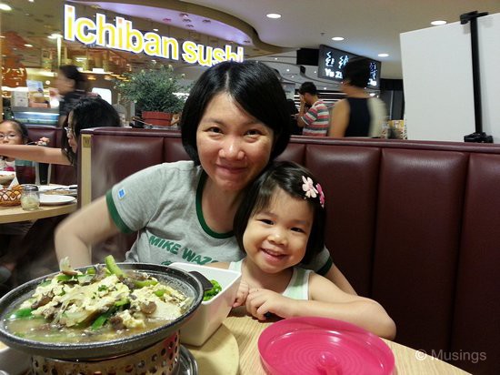 The two girls over dinner at Lenas @ Hougang Mall, our Friday dinner hangout. That item in the foreground is Sauteed mushrooms in egg sauce, alongside arlic rice, salad and soup as sides. 
