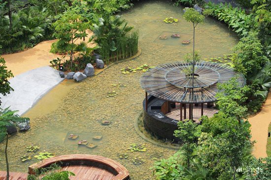 The circular BBQ island has been installed with roofing, similar to the croquet lawn observation post.