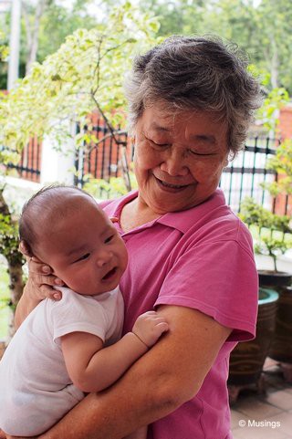 Peter with mom. He's able to recognize faces now, and has responded especially well to his big sister.