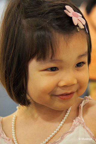 3 Years 9 Months old in March 2013, and wearing her faux pearl necklace given to her by her maternal grandmom. That necklace has gone through a lot of abuse though, and finally broke apart irreparably earlier this month.