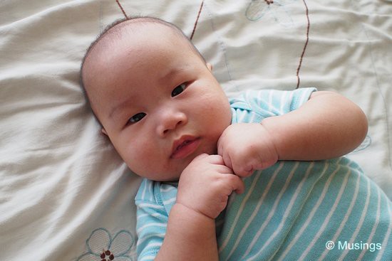 On our bed and just before heading out for breakfast. We've been getting Peter to try standing on his two little feet. He really enjoys the experience, and is a nice counter whenever he's about to break into a bawl.