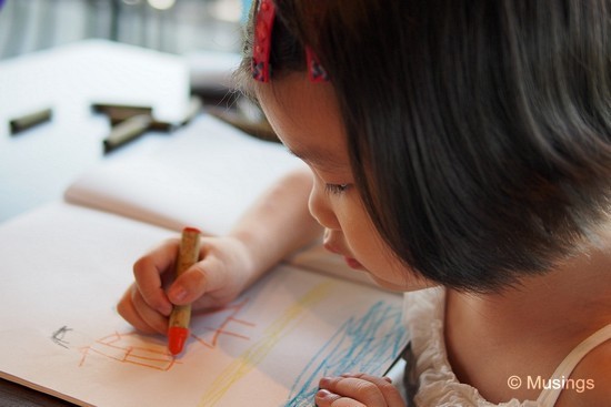 Post breakfast activities @ Coffee Bean. She's been drawing a lot - so much so that I'm seriously toying with the idea of buying her a Galaxy Note tablet. Taken using the 25mm and at f1.8. Hannah was seated right beside me, so this required quite a bit of arm contortion for me to put both her drawing, her crayon on her right hand, and part of her face into the frame!