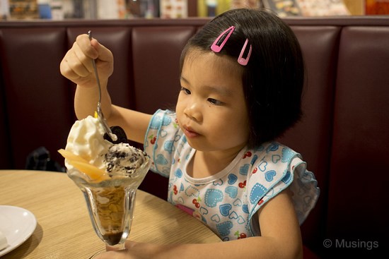 Helping herself to the complimentary birthday ice-cream at Lenas.