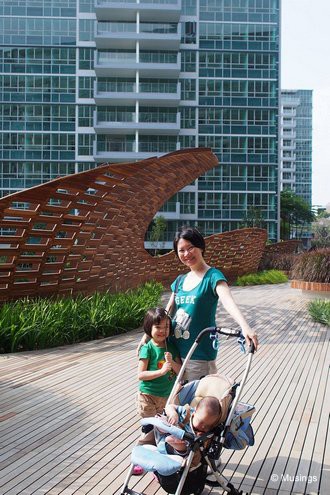 At the contemporary bridge. Peter is more interested in the bridge's wood decking.=)