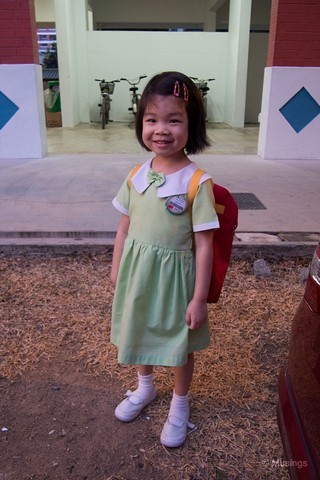 Hannah in her school uniform and waiting at her new nanny's place. Our morning routine involves us driving to the new nanny's place, and waiting for her bus pick-up. That's meant at least 5-10 minutes more of bonding time each morning while waiting for her ride.