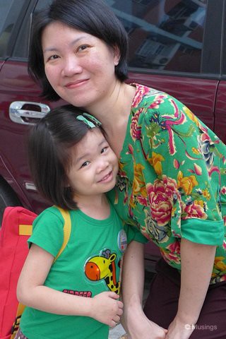 Girls in green, and on another morning while waiting for Hannnah's ride; she's out of uniform as it's Friday - which occasionally is home clothes day for the kids.