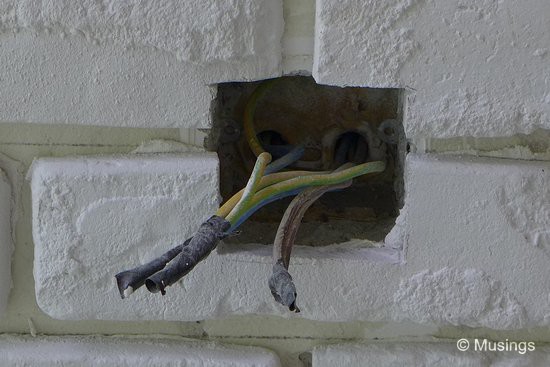 As its fashionable in today's brick walls; the power socket from the earlier wall had been relocated, and will be installed on top of the craft bricks.