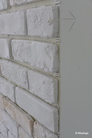My sister-in-law had a similar brickwall in her home, and she remarked that it could be quite painful if someone carelessly bumps into the wall edge. We'll be getting our designer to smooth over the sharp edges here.