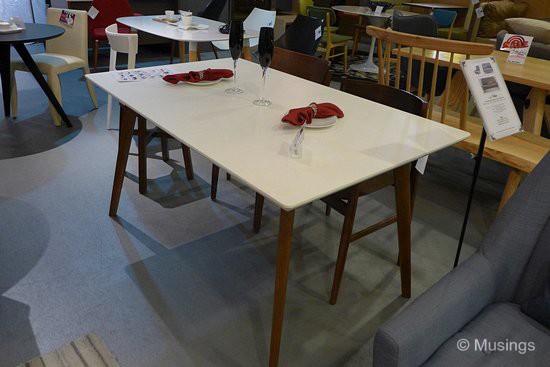 'Paradigm' table in white top with wenge legs, and at S$662. We saw another option we liked - a completely white table with tempered glass top - but we both liked this one more for its color balance against the craftbrick wall just beside it.