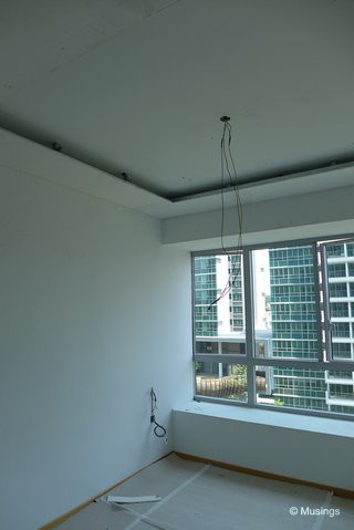 Likewise for our Master Bedroom. Taking a close look at the ceiling boards note that they are secured by steel brackets drilled into the concrete ceiling.