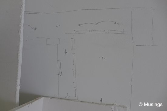 The false ceiling and covelighting plan for the living/dinnig hall scribbled onto the wall. It'll be painted over later.