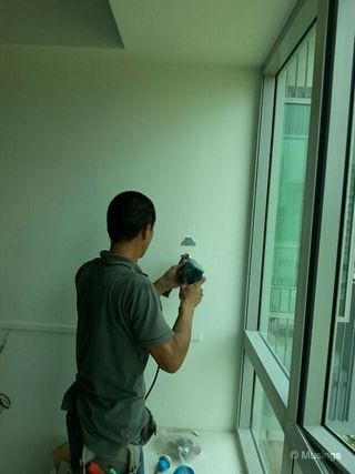 Electrician in our children's room preparing the wall for Philips Kid's Space wall lights.