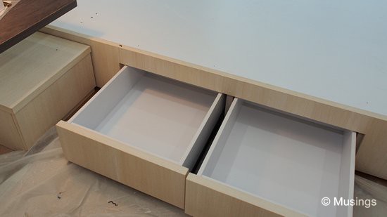 Four drawers built into the bedframe base. 