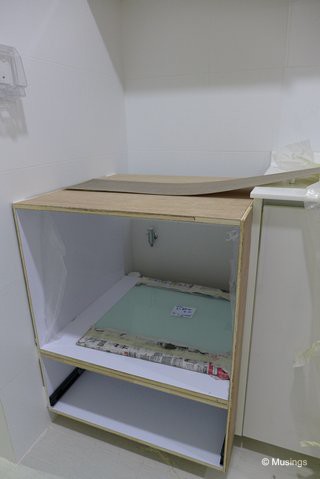 Our dishwasher cabinet in progress. The height for the dishwasher shelf is 46cm, just enough for our 45cm dishwasher itself. Wished we'd asked for just a bit more clearance, but that's our bad. The glass board you see there is for our dry kitchen - our writing board for all manner of stuff.:)