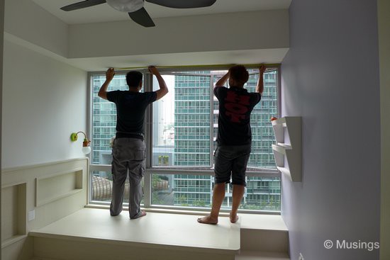 Marking out drilling holes to mount the blinds frames in the children's room. 