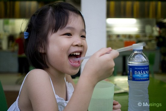 Hannah having fun with ice water and a straw. This was over dinner at a Malay-Muslim cafe @ Hougang Avenue 1. They whipped up wonderful Roti Johns (our Ang mo friend will be thrilled to hear that!).