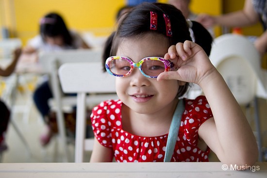 Still wearing her pair of kiddie sunglasses that we bought her for a third year old birthday two years ago.