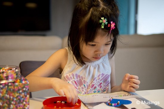 Another one of those 'in' activities now for kids. Ling bought her a large jar of Pyssla beads from Ikea. She's put together simple patterns and have been proudly presenting them to everyone around her.