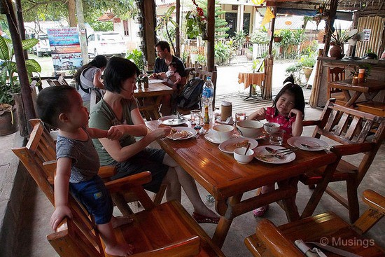 Inside Bamboo Hut. The two streetside restaurants didn't have baby-friendly seating, so the both of us had to take turns eating with one hand and holding onto Peter with the other.