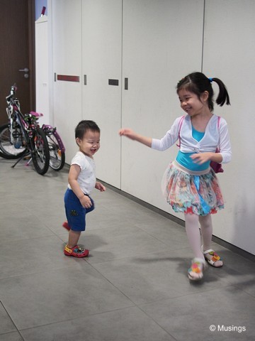 Playing catch at the lift lobby - we were just about to head out for Hannah's weekend ballet classes.