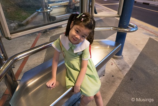 Waiting for her morning school bus at 0700 hrs. The bus-stop was actually quite dimly lit, but sufficient facial detail was retrieve through Adobe Camera Raw.