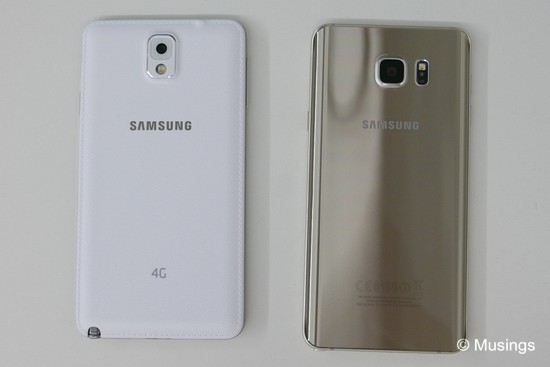 Very different backs. One is premium-looking but a real fingerprint magnet!