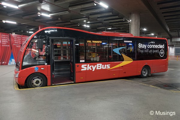 SkyBus painted in their distinctive red. The bus fleet is modern, and comfortable.