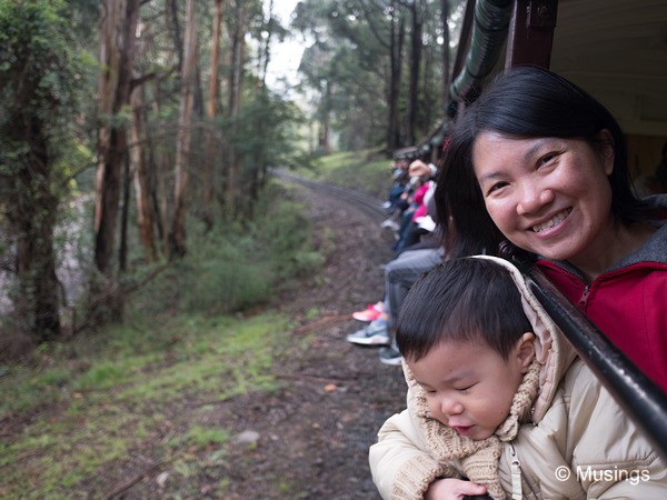 Mommy holding onto Peter - otherwise he'd slip off the train ledge!