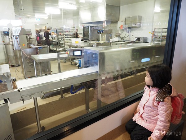 Large glass window into the chocolate kitchen.